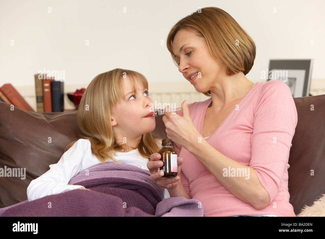 Mother Giving Medicine To Sick Daughter Stock Photo Alamy