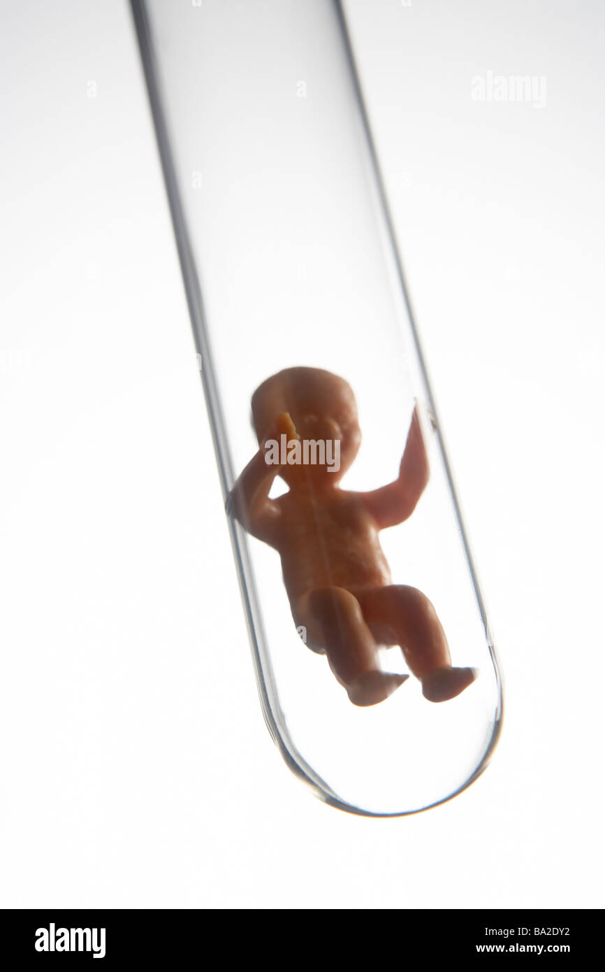 Baby Figurine In A Test Tube Stock Photo