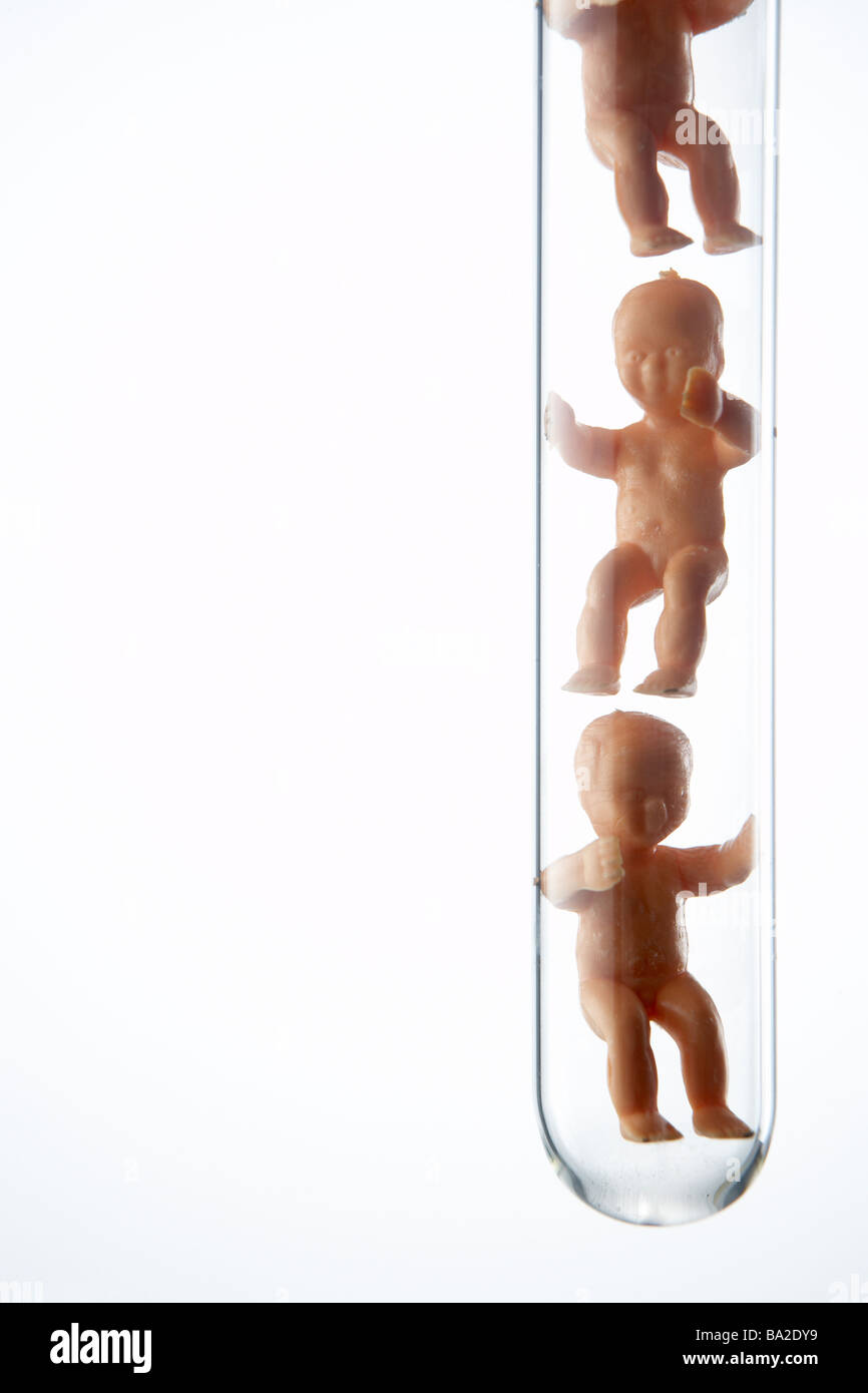 Baby Figurines In Test Tubes Stock Photo