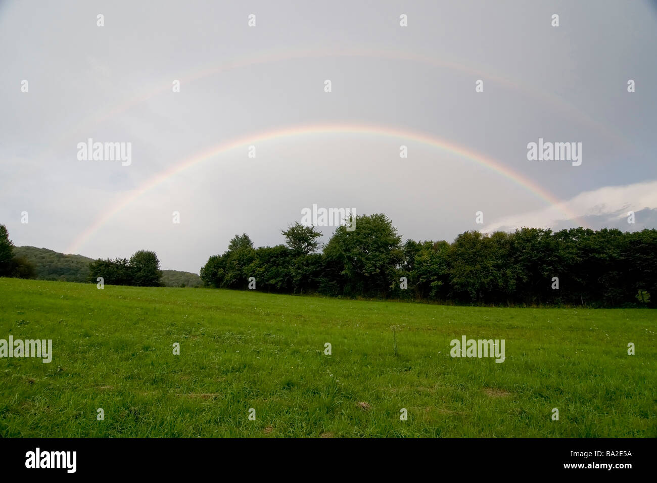 Rural scene with rainbow Stock Photo - Alamy