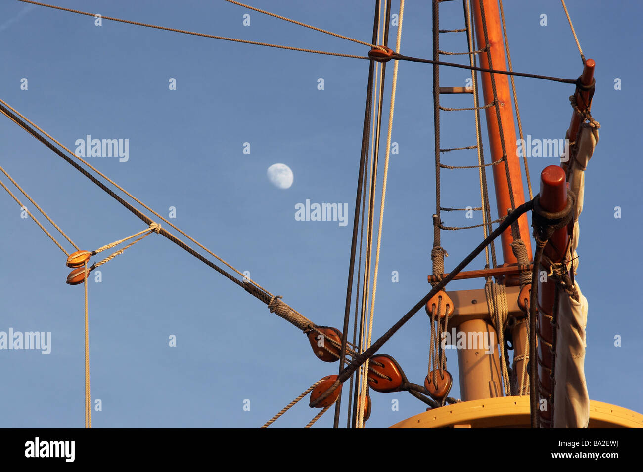 The moon visible between block and tackle rigging on a Jamestown Settlement ship Stock Photo