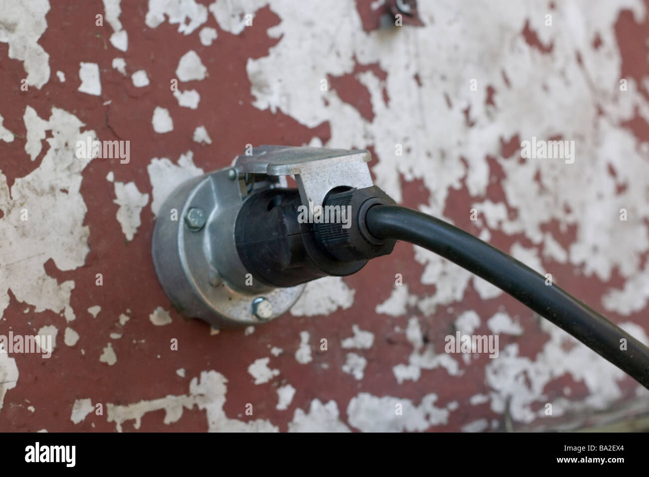 Electric plug in wall with cable connected Stock Photo Alamy