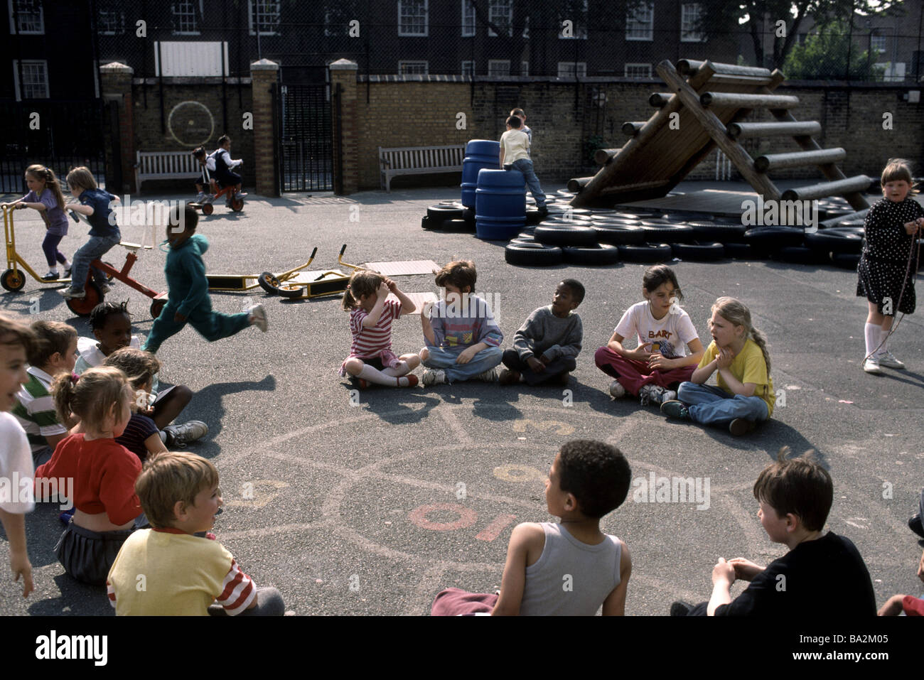Primary school playground where children are playing games Stock Photo