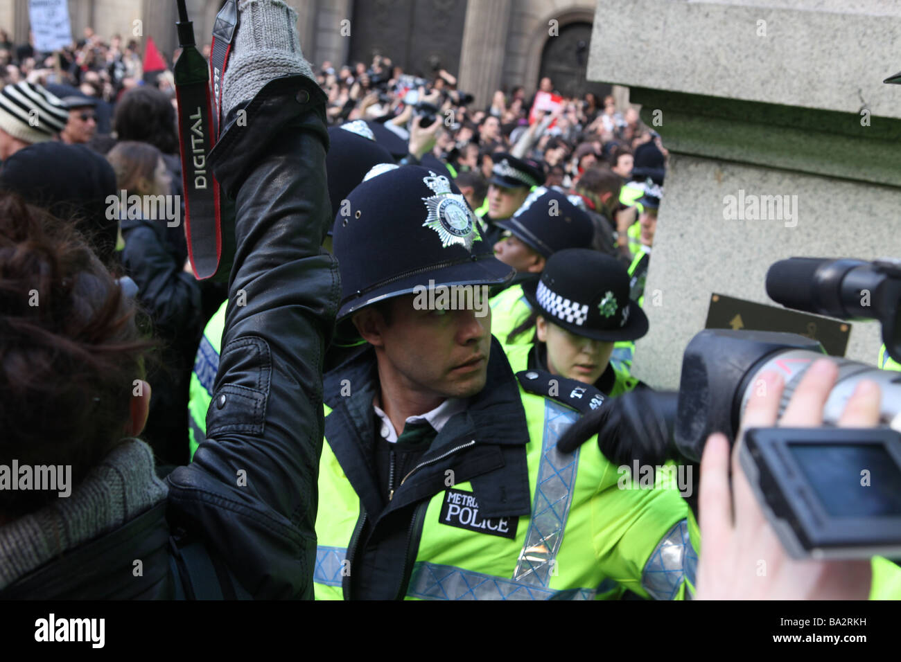 police lined up stopping protesters during the g20 protests in london. they are preventing protesters leaving the protest Stock Photo