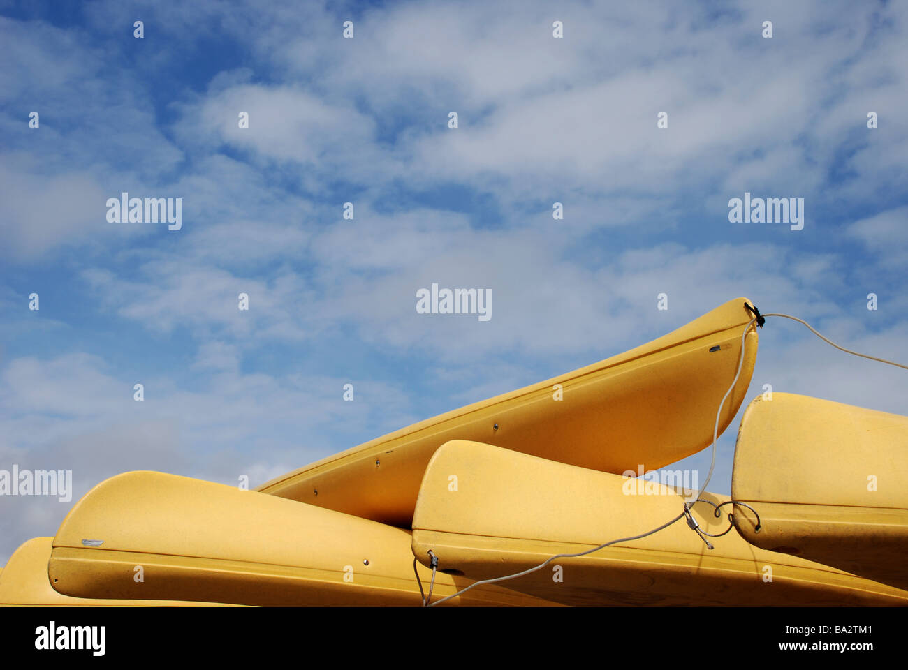 Yellow kayaks  against blue sky Stock Photo