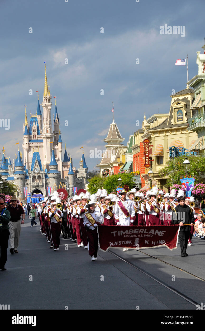High School Band in Parade at Walt Disney Magic Kingdom Theme Park Orlando Florida Central Stock Photo