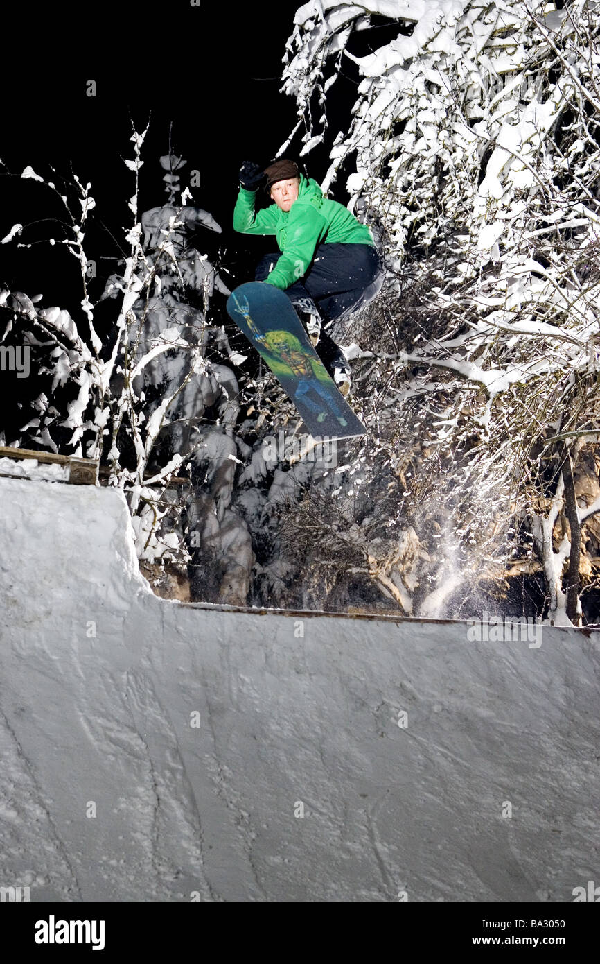 Snowboarder heed Moritz Liebig Profisnowboarder personality-rights Funpark jump evening man young Snowboard Snowboarden jumps Stock Photo