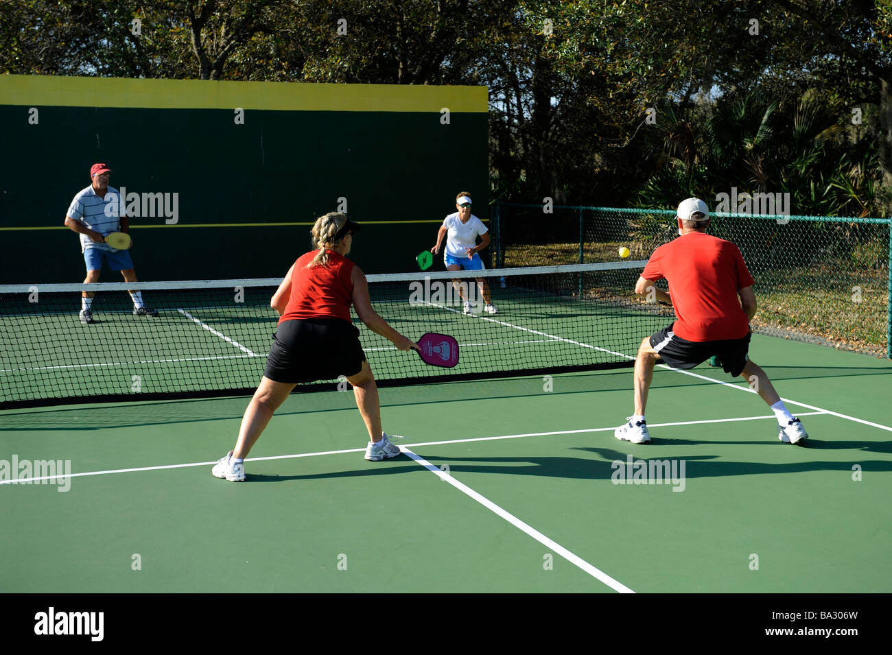 Senior citizens compete in game of Pickleball in the Senior state Olympics near Naples Florida Stock Photo