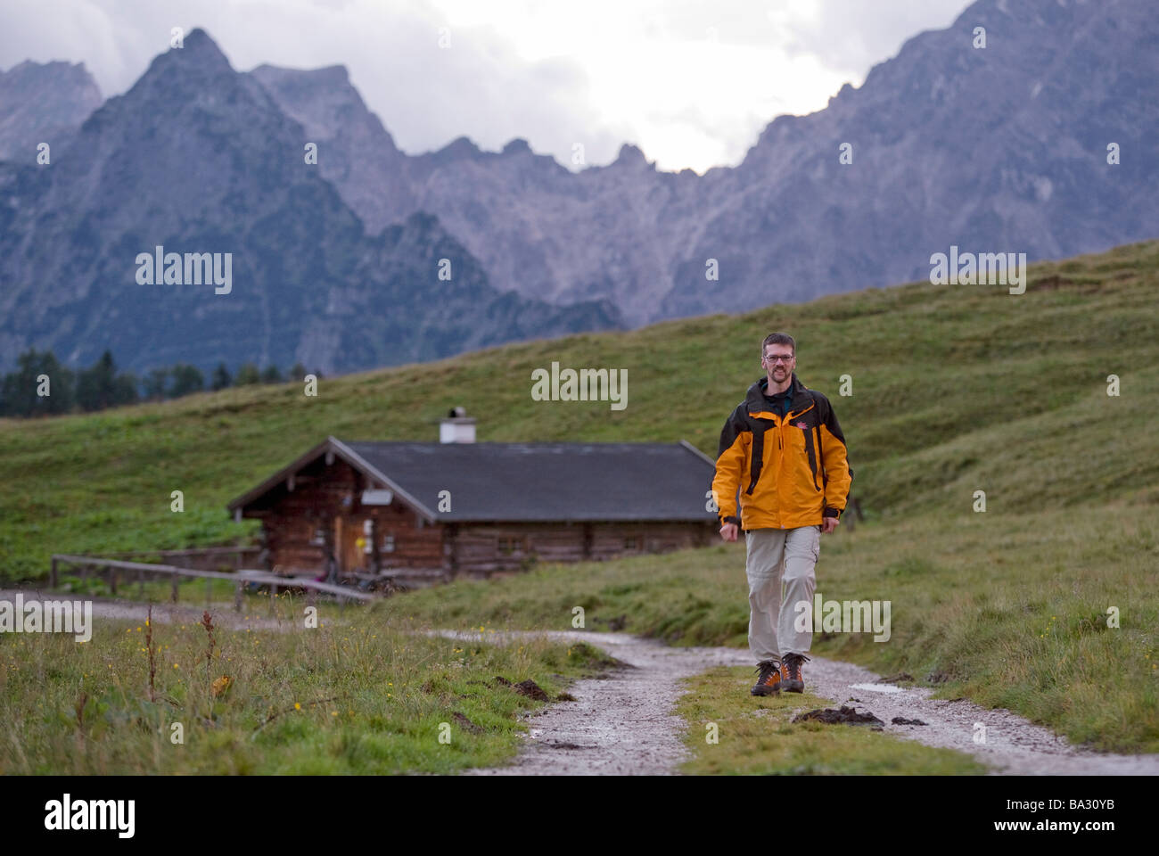 Middle aged hiker on trail near Koenigssee Berchtesgaden Alps Germany August 2008 Stock Photo