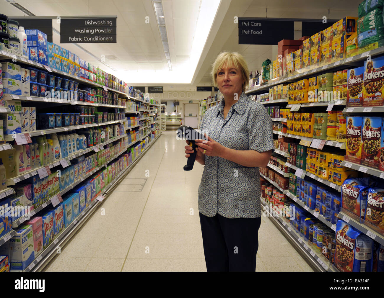 Store worker at Waitrose supermarket Stock Photo