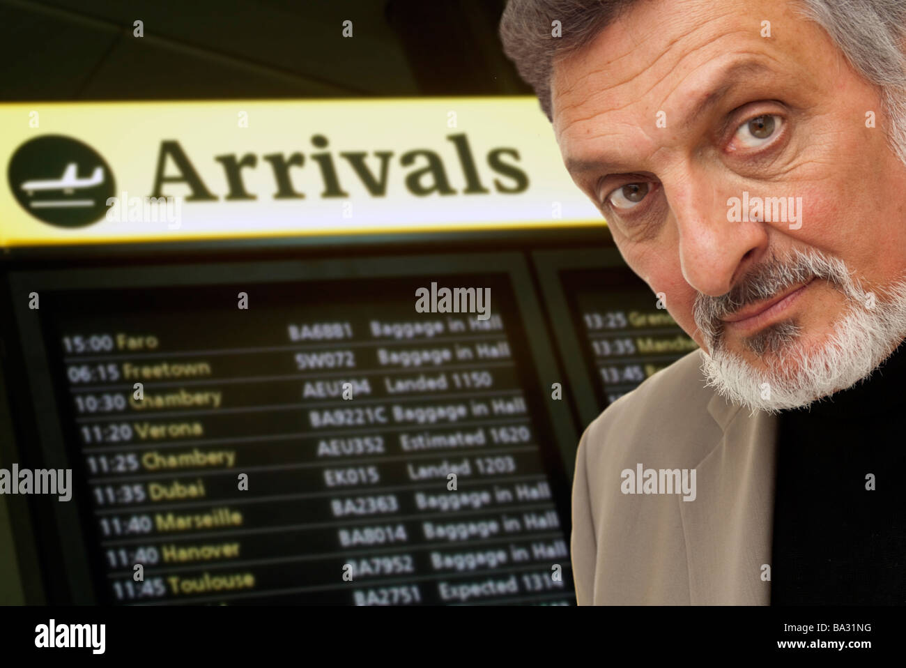 close up of a mature man in the arrivals hall in an airport Stock Photo