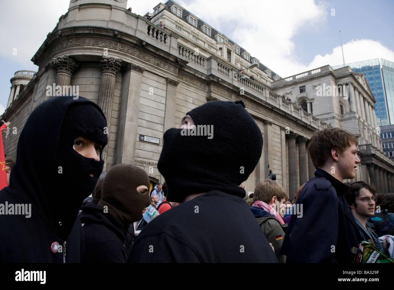 Young men wear face masks during the Bank of England during G20 protest Stock Photo