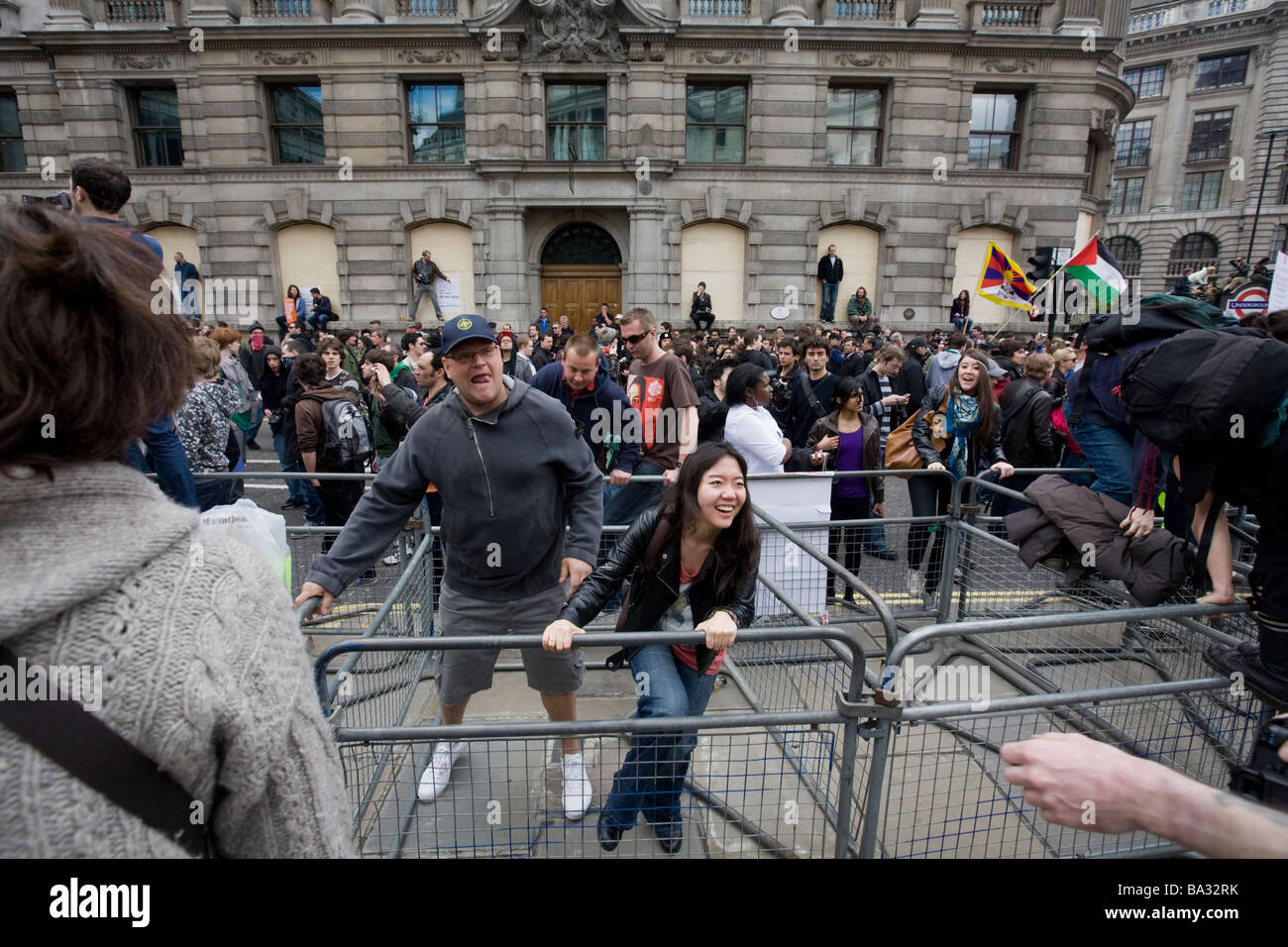 Protesters move across barriers at the G20 protest at Bank of England Stock Photo
