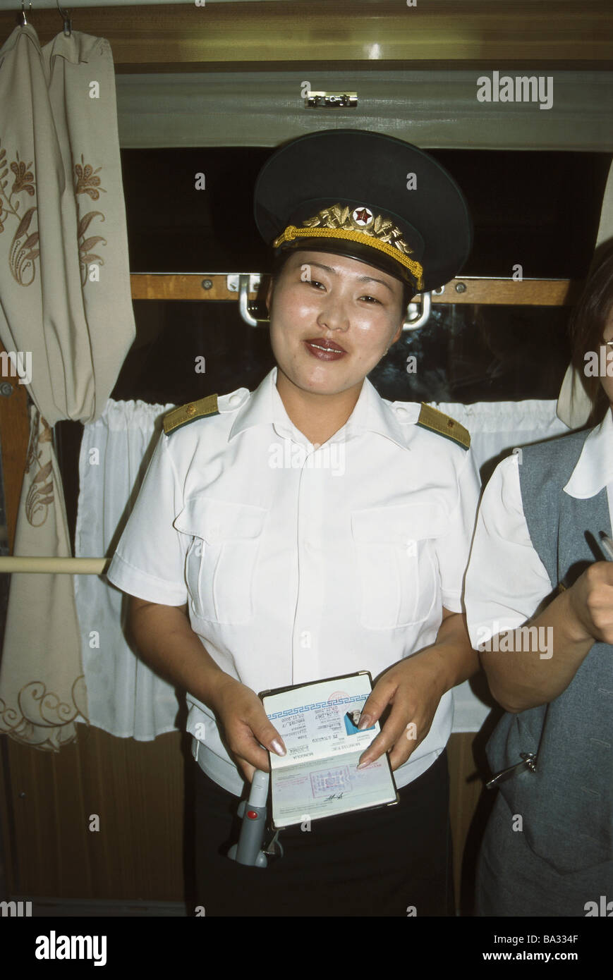 Transsibirische railroad compartment controller uniform semi-portrait no models Mogolei Transsib trans-Mongolian release Asia Stock Photo