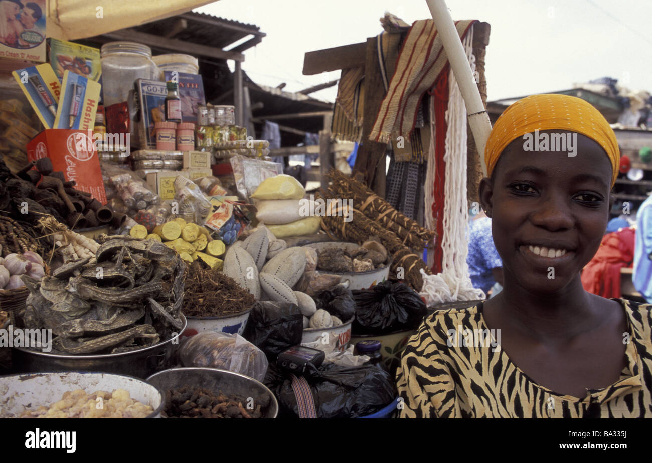 Ghana Kumasi market woman portrait smiles no models black-Africa city market-stand merchandise release Africa food sales Stock Photo