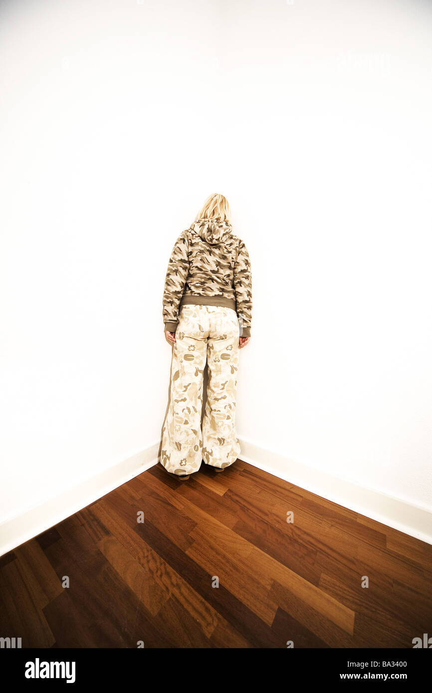 Woman young room-corner stands back-opinion series 20-30 years blond leisurewear clothing Army-Look camouflage arrest is Stock Photo