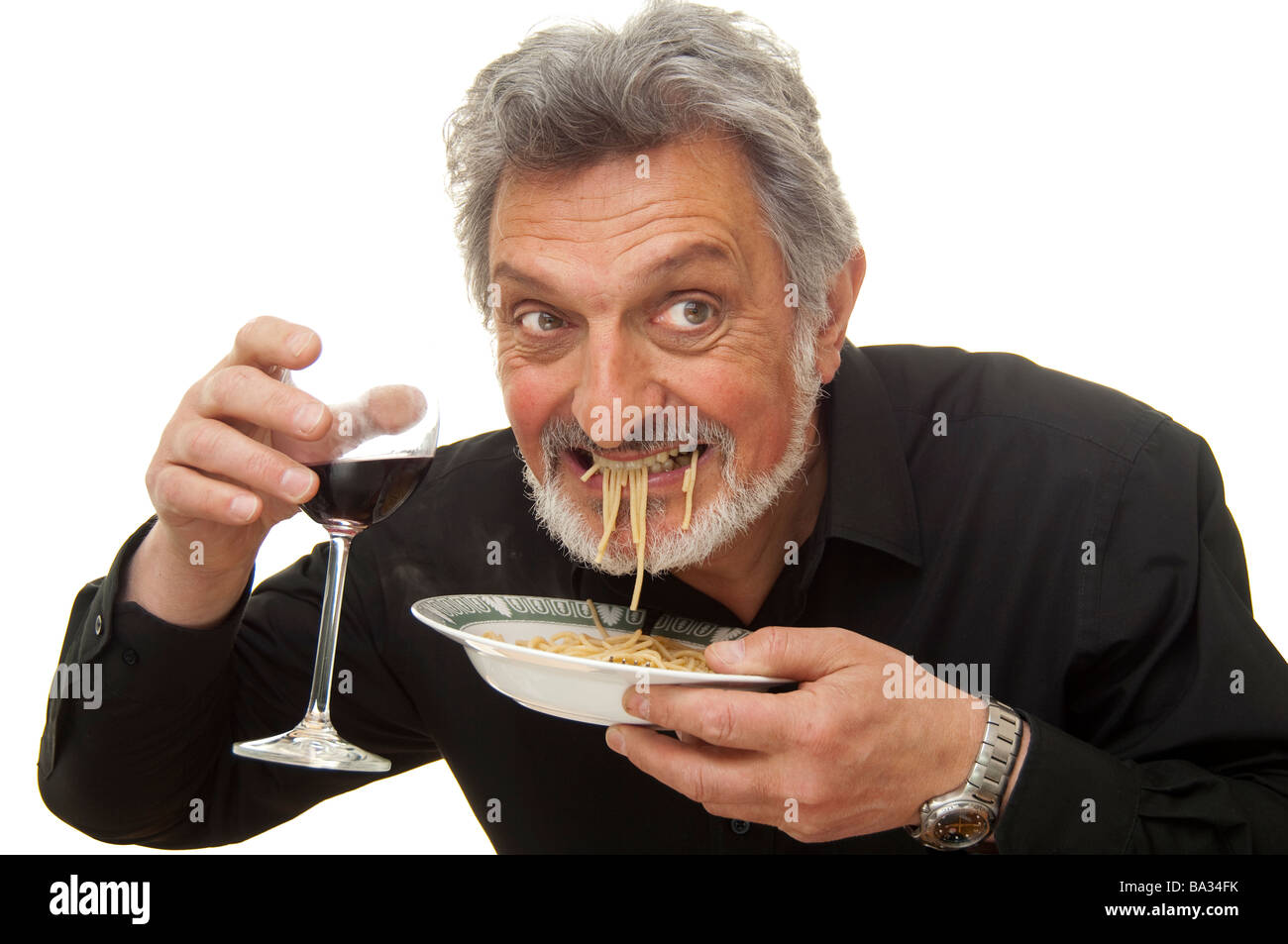 man eating pasta Stock Photo