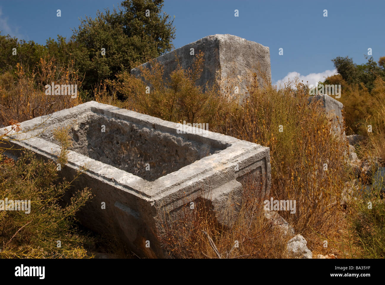 An overturned sarcophagus stone coffin lid in Ucagiz, Turkey Stock Photo