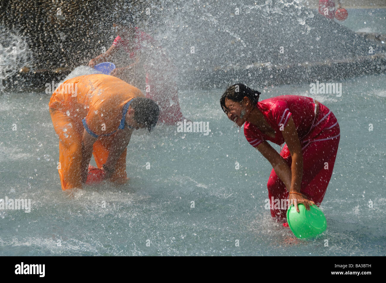 the biggest water fight party in the world as the Dai minority celebrates the SE Asian new year in Yunnan China Stock Photo