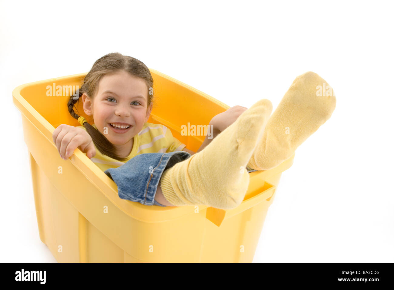 girl in yellow container Stock Photo