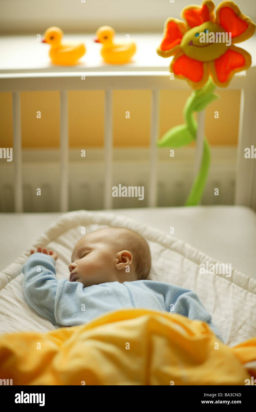Baby in cot asleep hi-res stock photography and images - Alamy