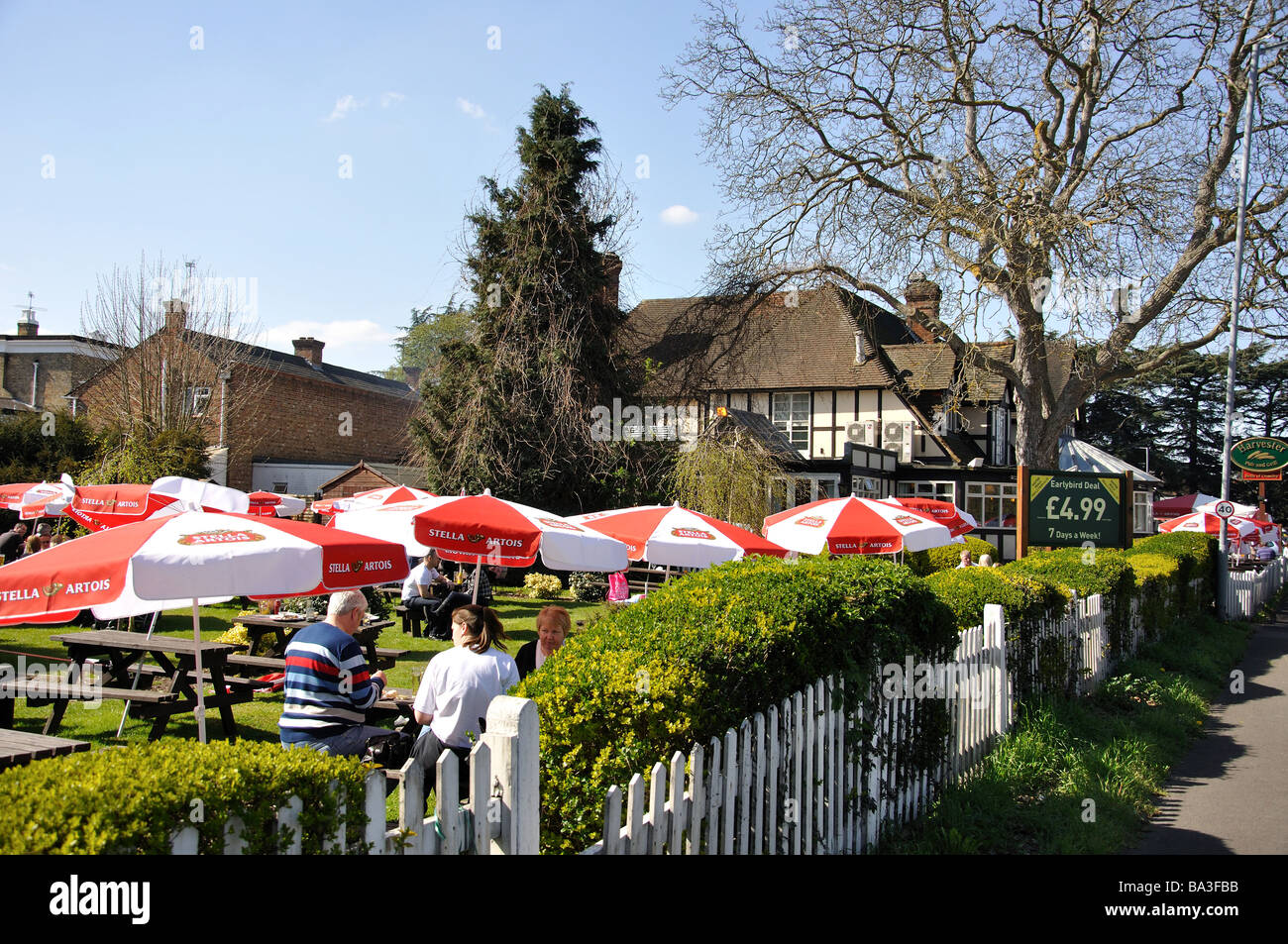 Beer garden, Bells of Ouseley Harvester Restaurant, Straight Road, Old Windsor, Berkshire, England, United Kingdom Stock Photo