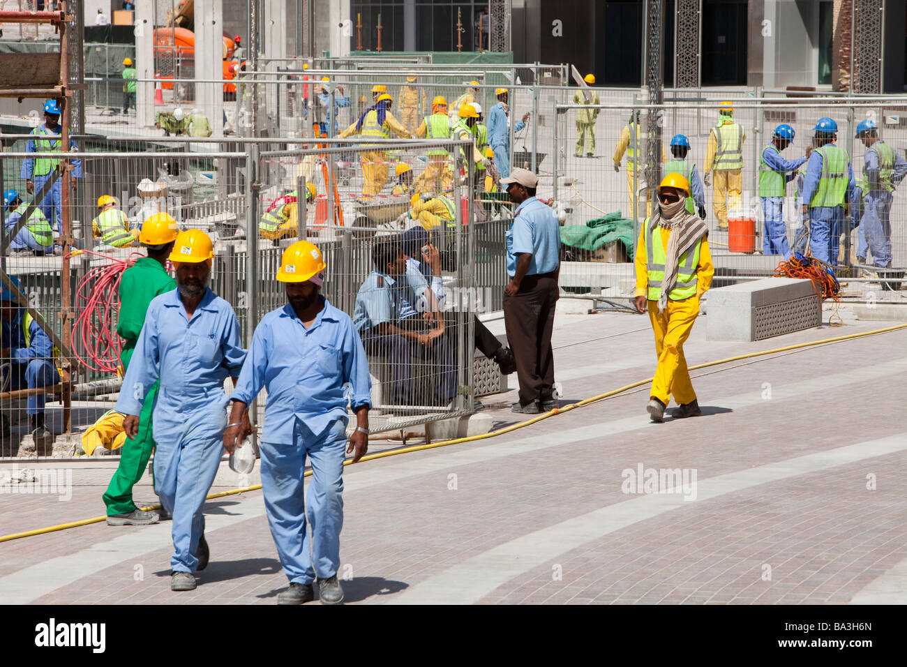 Construction workers working near the Burj Dubai in Dubai Stock Photo