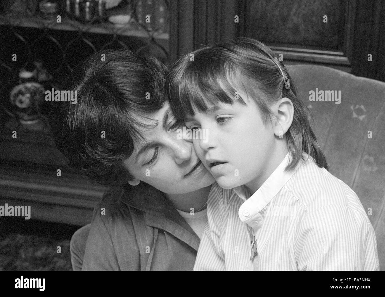 Seventies, black and white photo, people, young woman talking with a child, aged 30 to 40 years, girl, aged 10 to 12 years, Doris, Andrea Stock Photo
