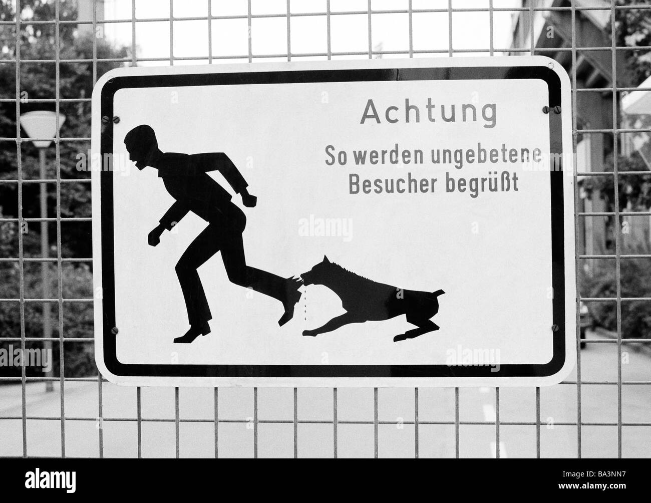 Seventies, black and white photo, symbol, prohibition sign, warning sign, Keep off the property, warning before a savage dog, Mind the dog Stock Photo