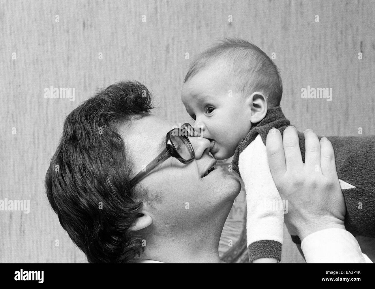 Seventies, black and white photo, people, young father carries the little son in his arms, aged 30 to 40 years, aged 1 to 2 years, Werner, Andreas Stock Photo