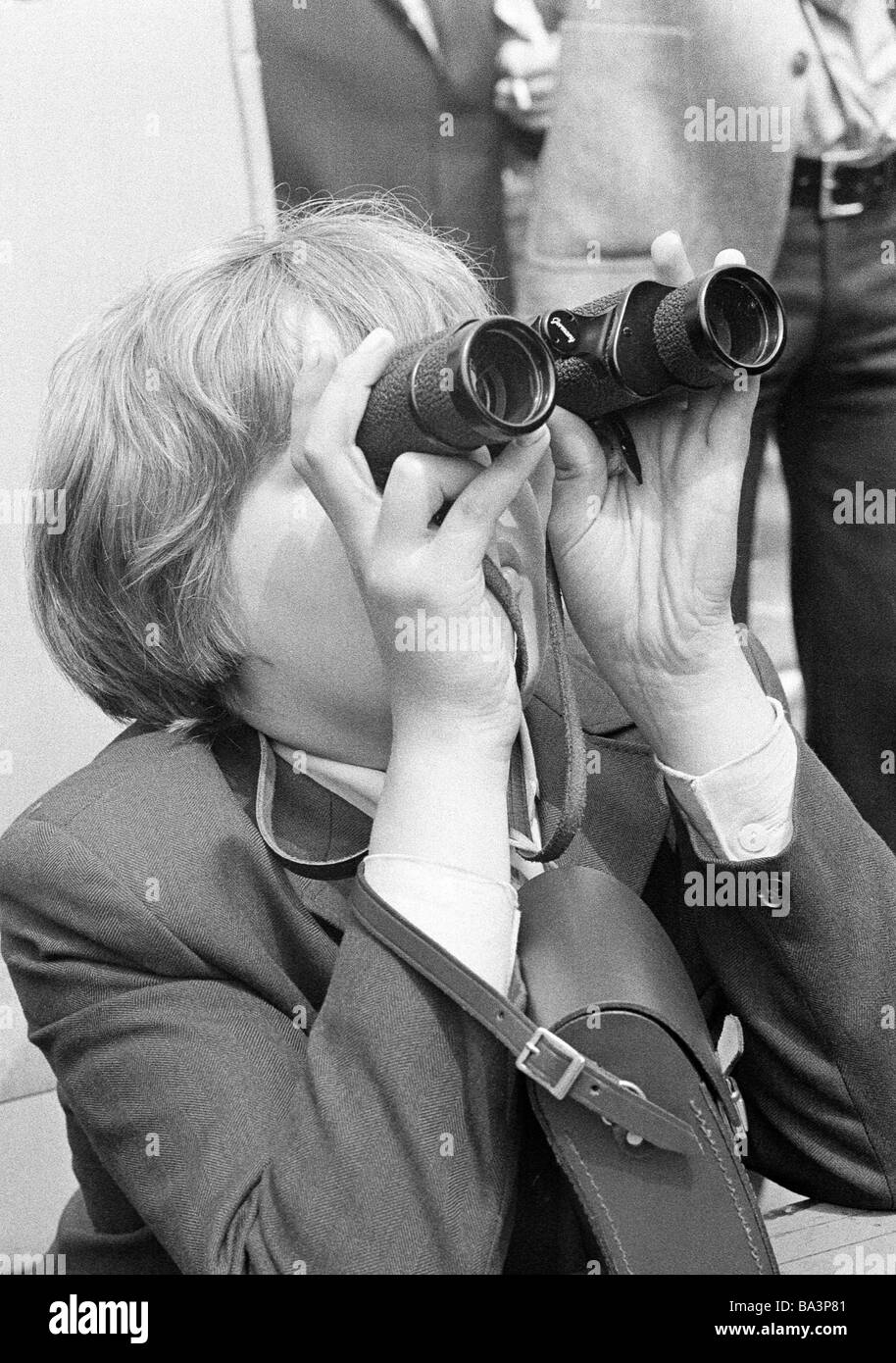 Seventies, black and white photo, people, boy looks through a binoculars, lookout, sight worth seeing, jacket, aged 10 to 12 years Stock Photo