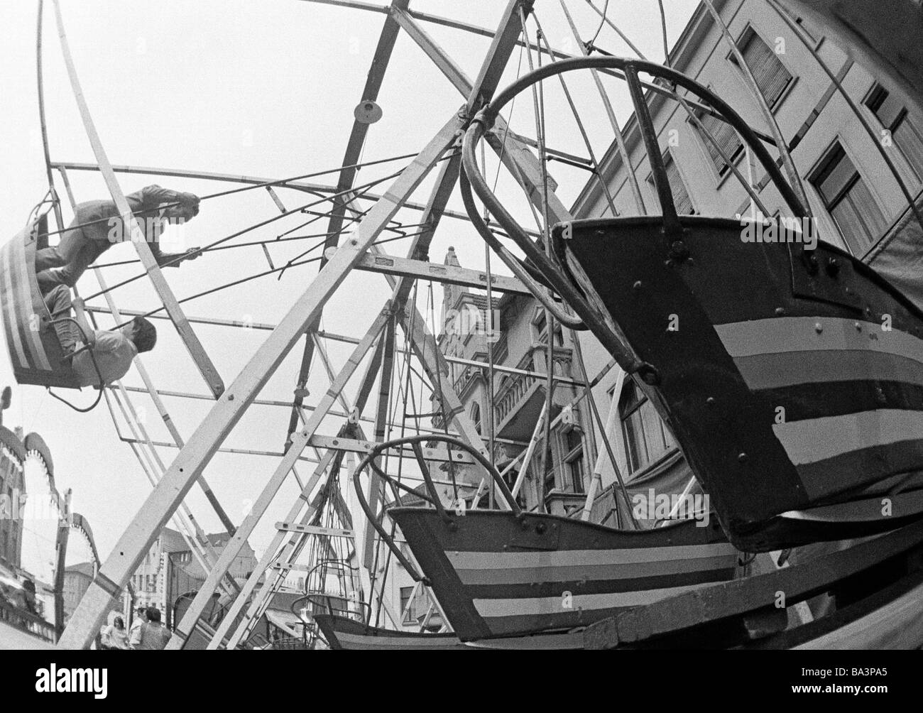 Seventies, black and white photo, kermess, people, teenagers in a swingboat, Corpus Christi Kermess 1973, D-Oberhausen, D-Oberhausen-Sterkrade, Ruhr area, North Rhine-Westphalia Stock Photo