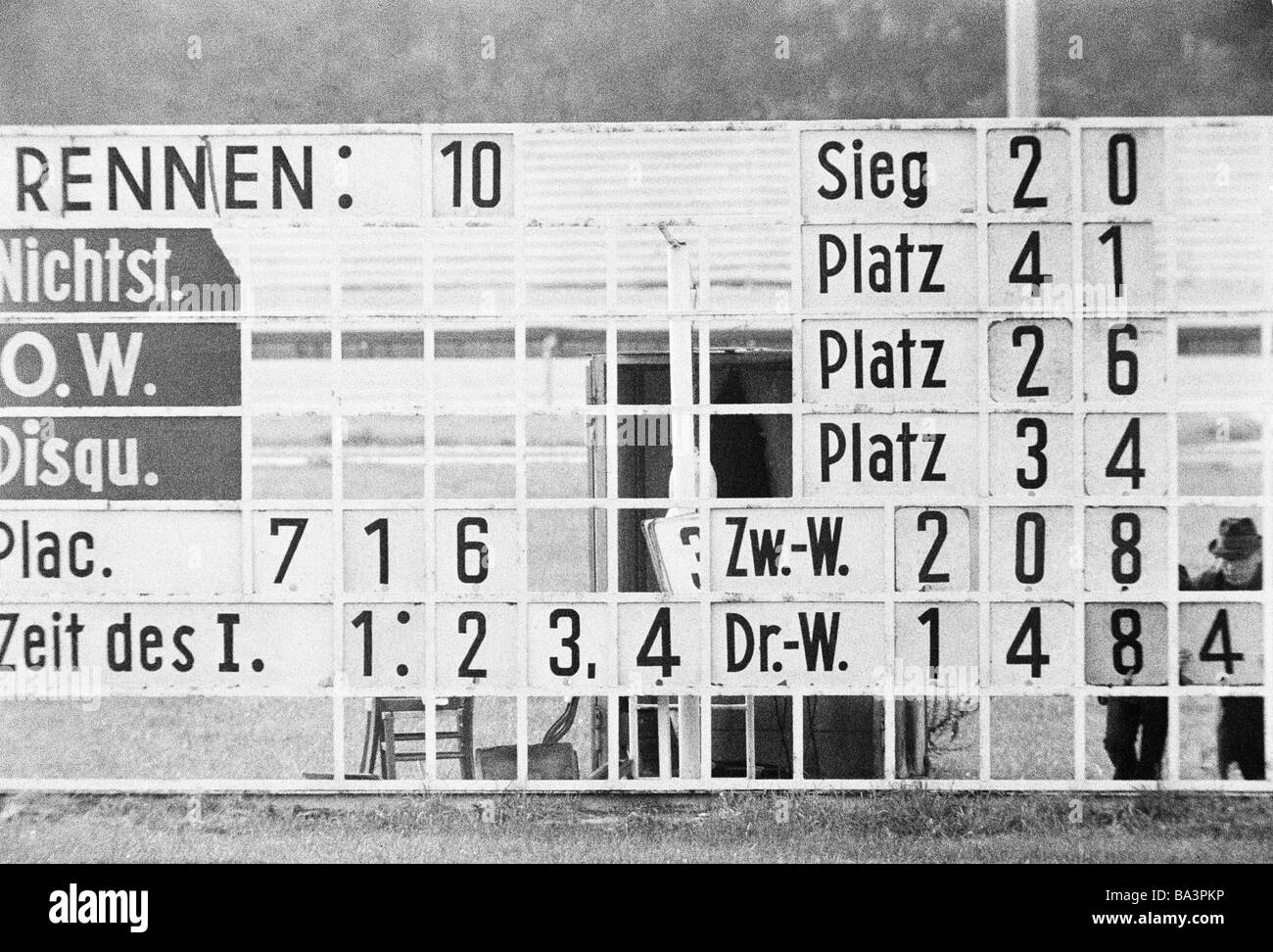 Seventies, black and white photo, sports, equestrianism, racecourse Dinslaken, trotting race 1973, horse-racing bet, scoreboard shows the results and the betting odds, D-Dinslaken, Lower Rhine, Ruhr area, North Rhine-Westphalia Stock Photo