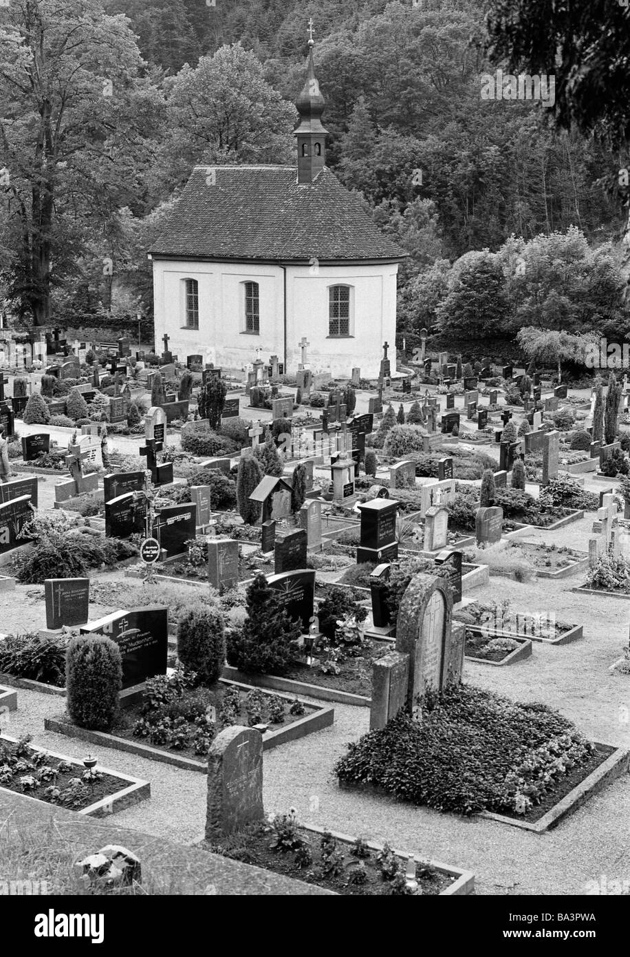 Eighties, black and white photo, people, death, mourning, churchyard, graves, grave stones, chapel, Black Forest, Baden-Wuerttemberg Stock Photo