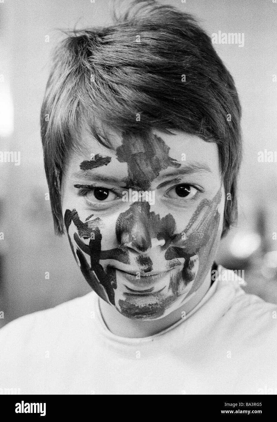 Seventies, black and white photo, humour, people, young girl, protrait, face is painted with colours, aged 20 to 25 years, Monika Stock Photo