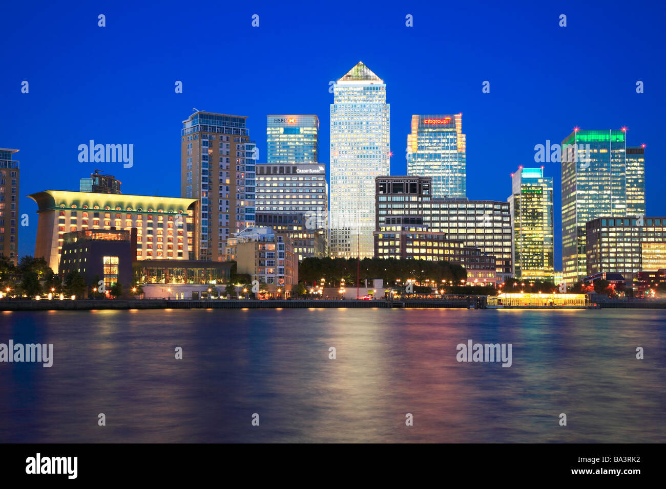 Canary Wharf at Night across the River Thames. Stock Photo