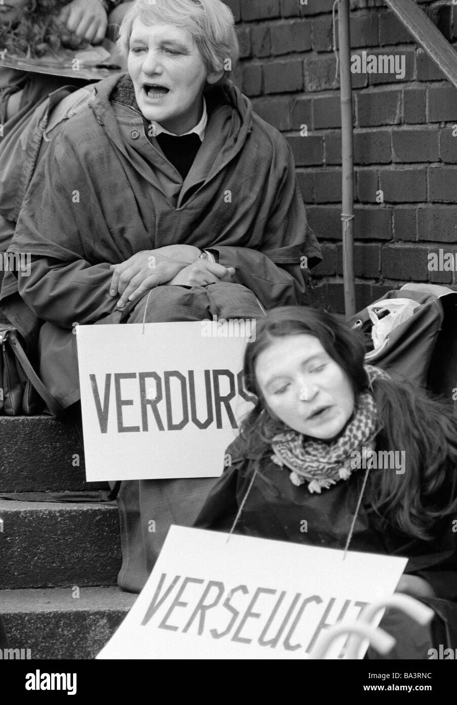 Easter marches 1983 in Germany against nuclear armament, two women presenting protest signs, aged 30 to 50 years, face white coloured, weird, D-Oberhausen, Ruhr area, North Rhine-Westphalia Stock Photo