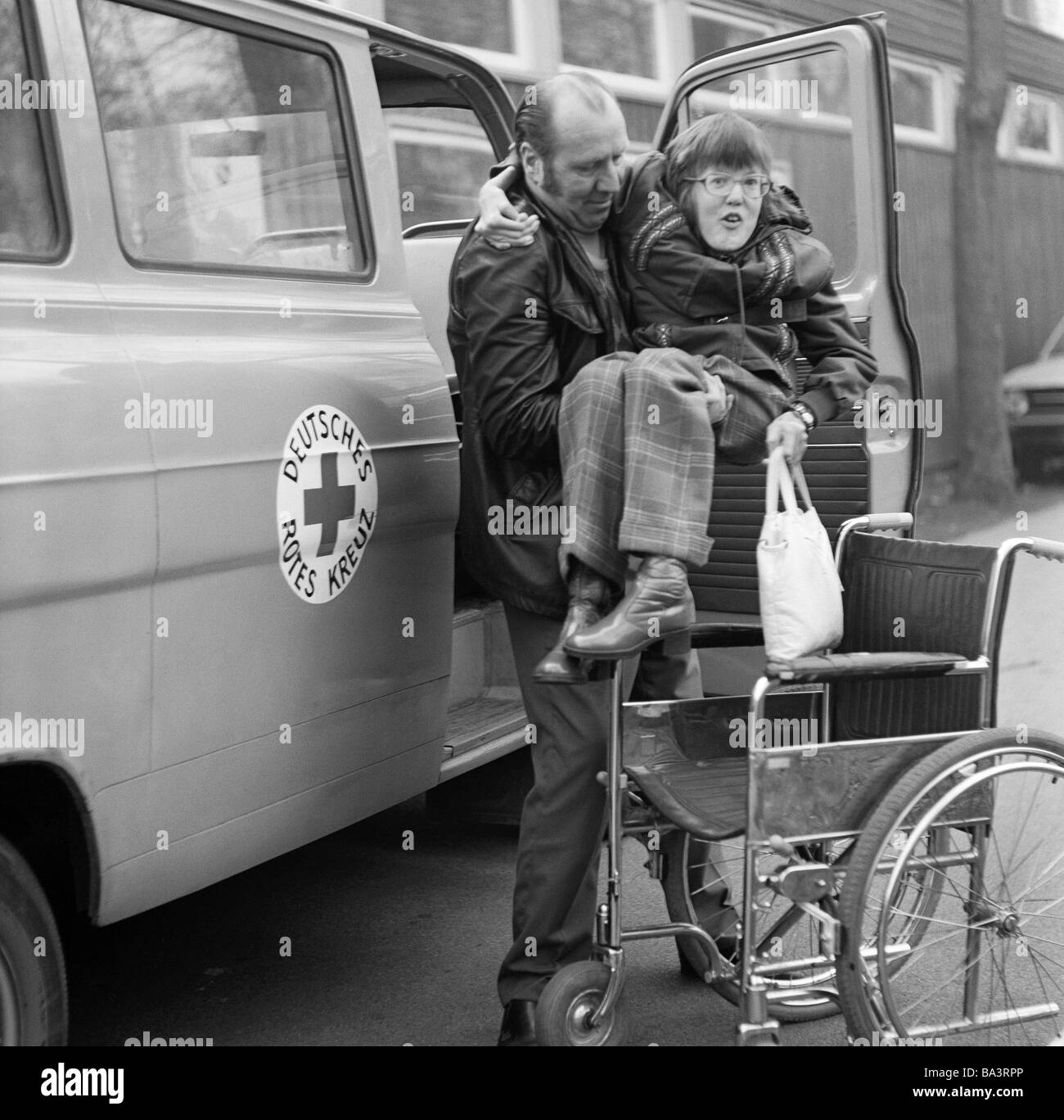 Helping the handicapped Black and White Stock Photos & Images - Alamy