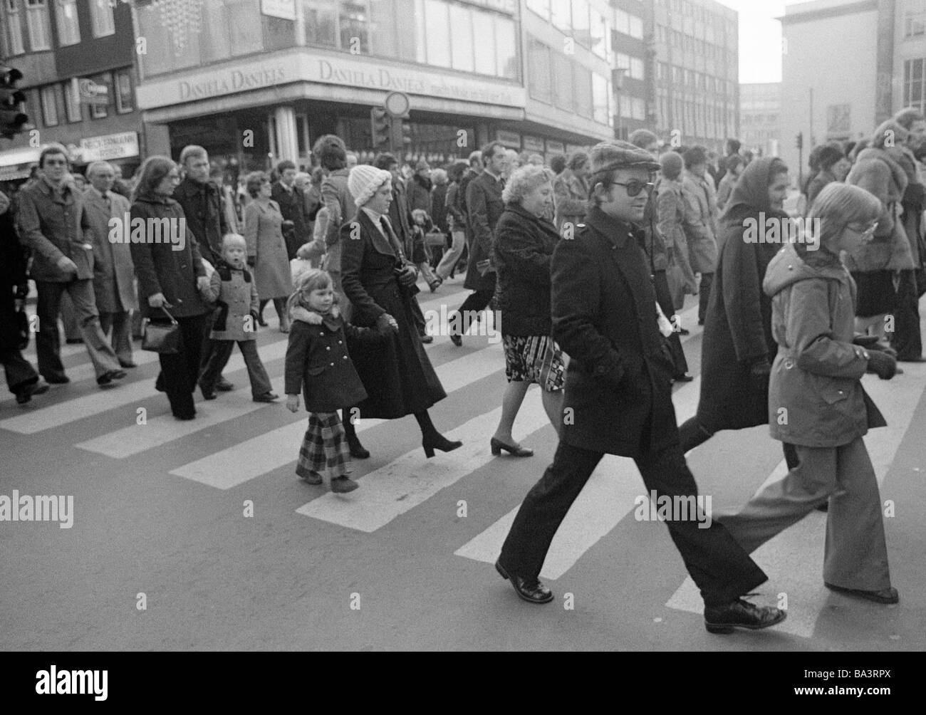 Seventies, black and white photo, people on shopping expedition, shopping street, pedestrian zone, zebra crossing, D-Essen, Ruhr area, North Rhine-Westphalia Stock Photo