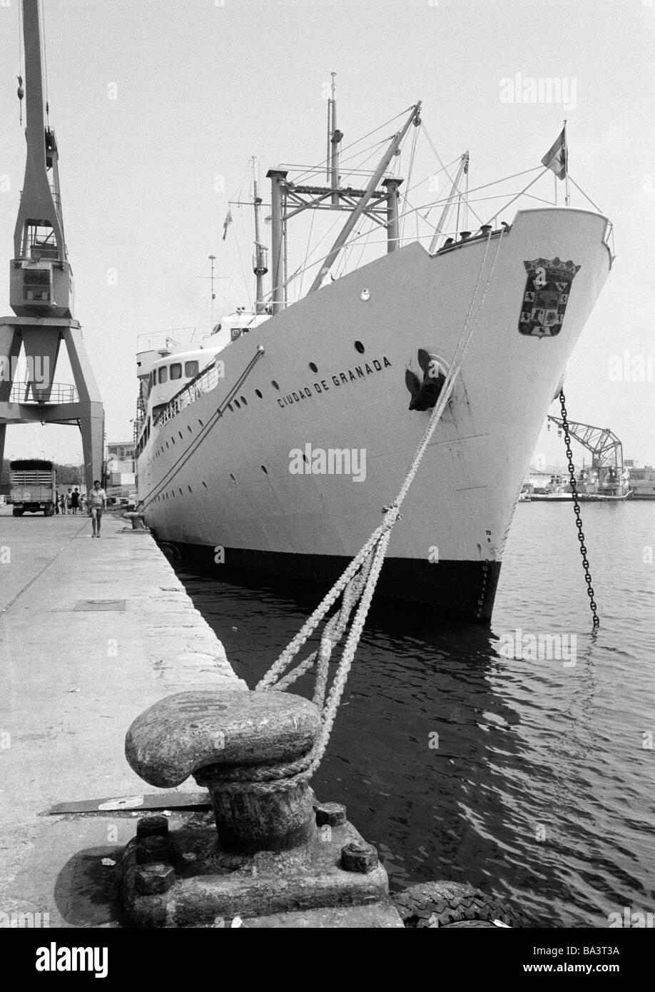 Seventies, black and white photo, maritime navigation, harbour of Valencia, freighter anchors on the quay, Spain, Valencia Stock Photo