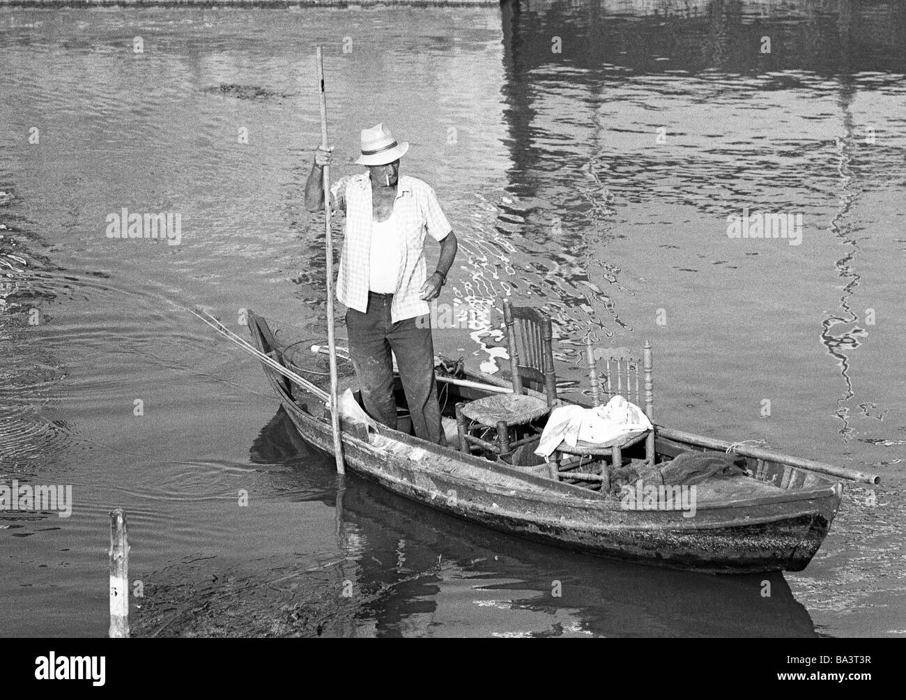 Seventies, black and white photo, fisherman in a fishing boat, aged 60 to 70 years, Spain, Valencia, Costa Blanca, La Albufera, Albufera Lake Stock Photo