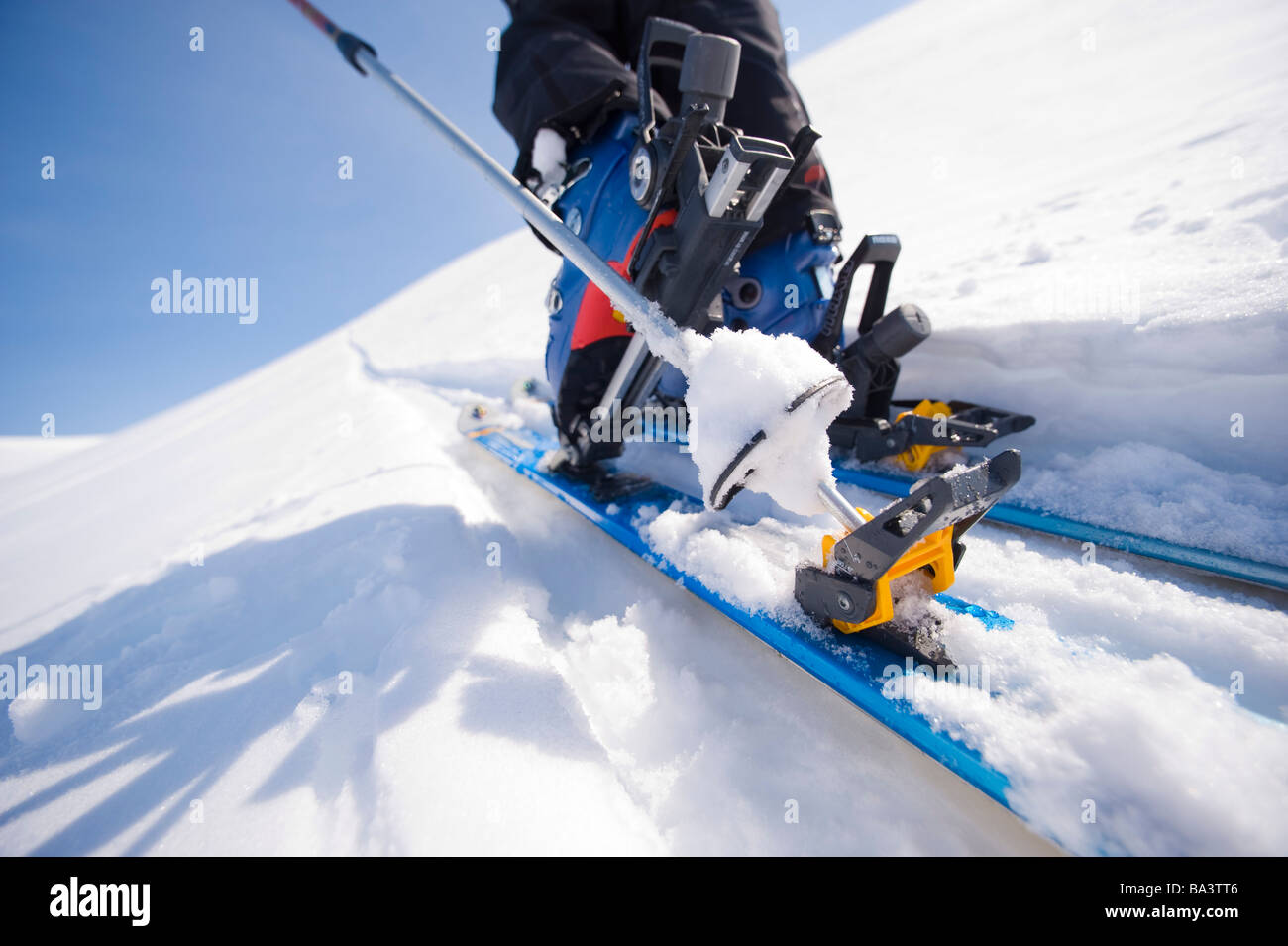 Close up of a backcountry ski and boot in motion on a trek in Alaska during Winter Stock Photo