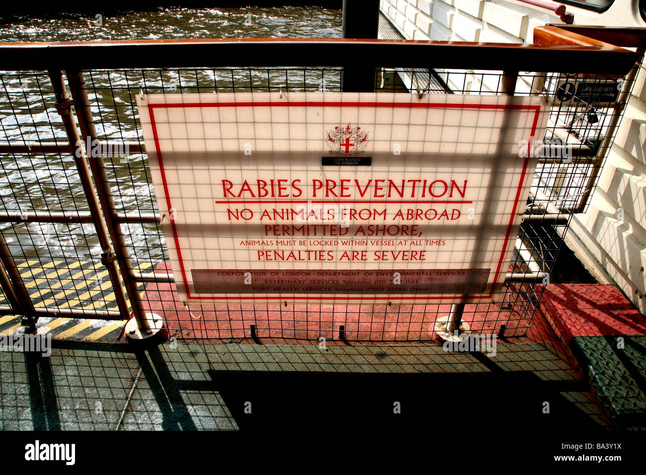 Warning Sign Rabies Rabies warning sign on River Thames pier, London Stock Photo - Alamy