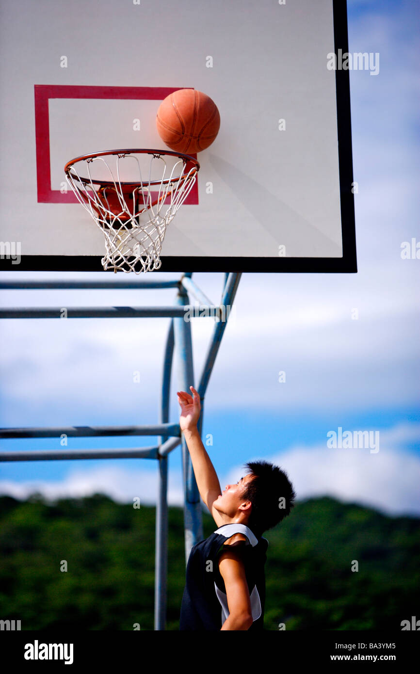 Basketball at the edge of hoop Stock Photo Alamy