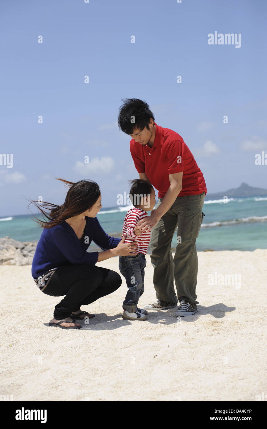 Asian family at the beach hi-res stock photography and images - Alamy