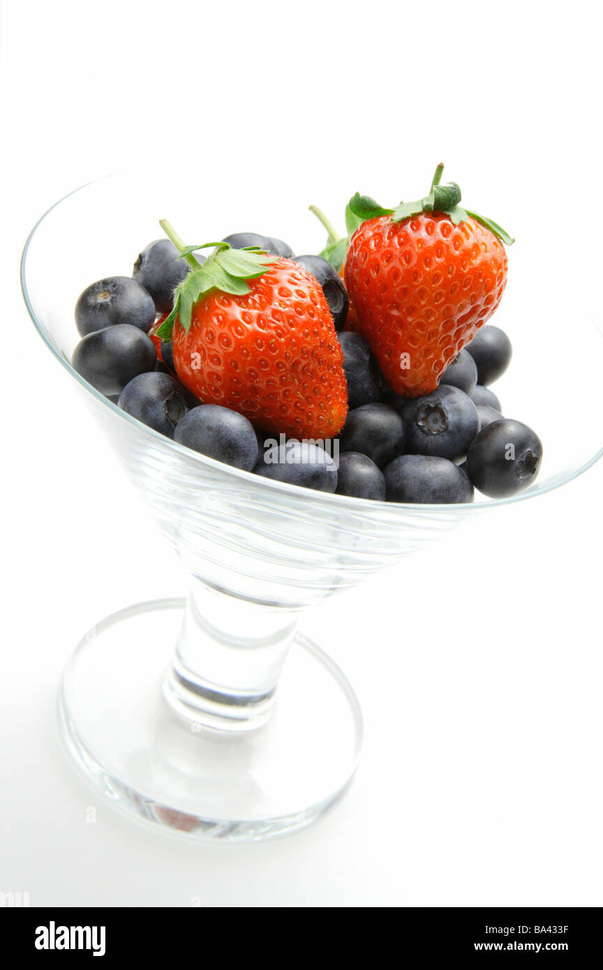 Glass with strawberries and blueberries Stock Photo - Alamy