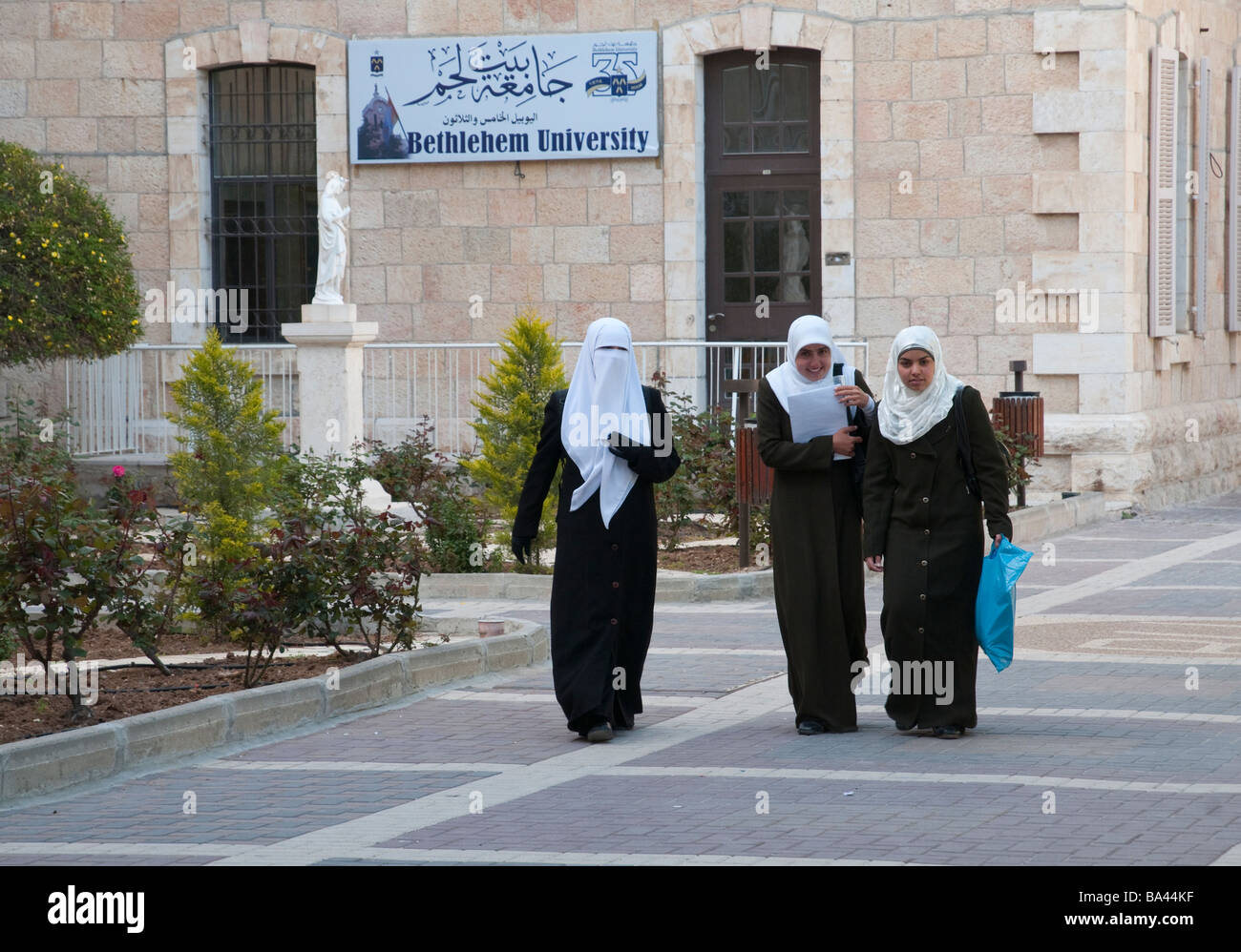 Palestinian Authority Bethlehem Bethlehem University 3 young muslem women walking together Stock Photo
