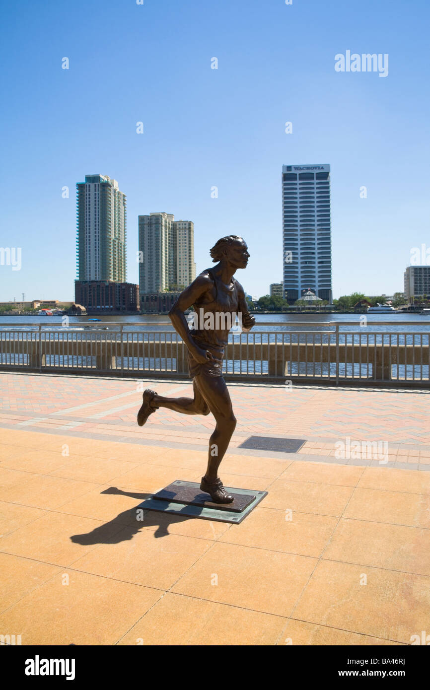 USA, Florida, Jacksonville - The Runner, a statue on the Northbank of the Riverwalk - Southbank in the background Stock Photo