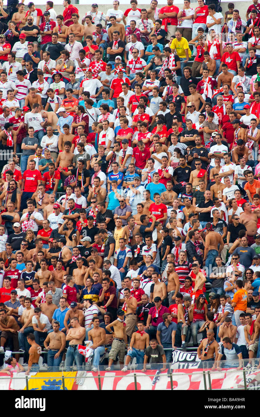 Sevilla FC young radical fans known as Biris cheering their team during Sevilla s local derby at Real Betis home Ruiz de Lopera Stock Photo