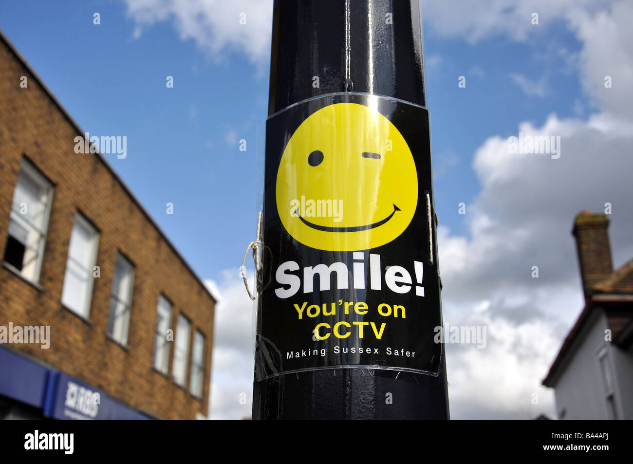 'Smile you're on CCTV' notice, High Street, Crawley, West Sussex